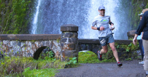 Runner at waterfall