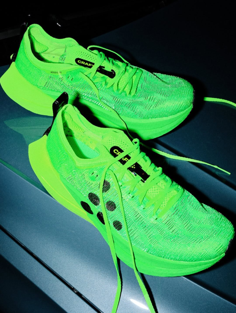 A pair of vivid green Craft Kype Pro super carbon plated race shoes.
