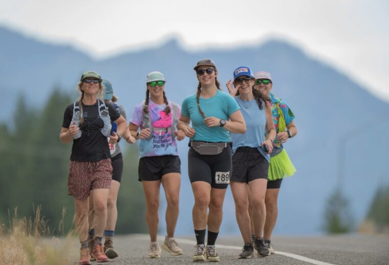 A group of running crew pacing their racer at the Cascade Crest 100