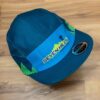 A blue and green Seven Hills Running Shop sublimated performance running cap from Boco Gear.